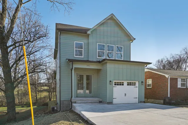 a front view of a house with a garage