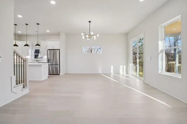 a view of a kitchen with a sink and dishwasher a refrigerator
