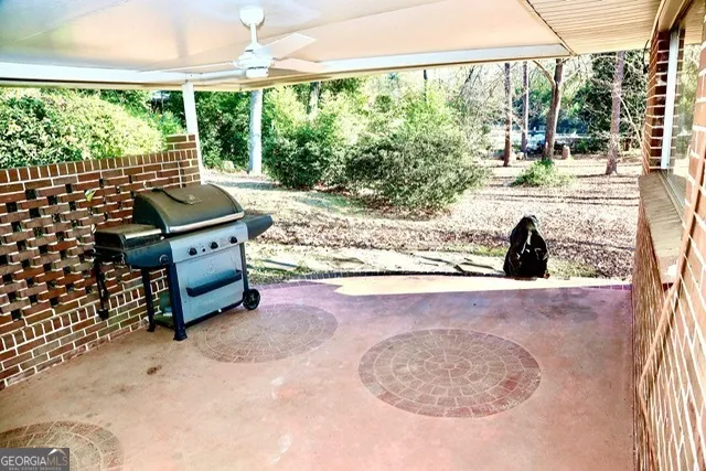 a room with pool table and chairs