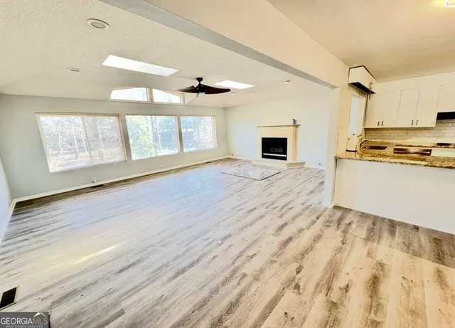 a view of a kitchen with a sink and a window