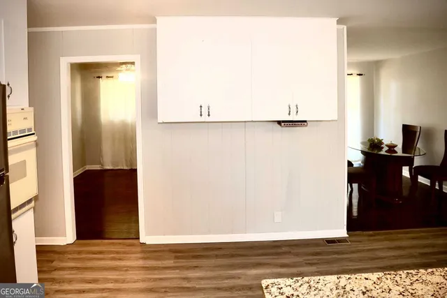 a view of a livingroom with wooden floor