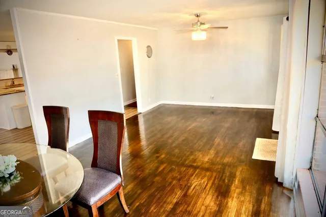 a view of a room with wooden floor