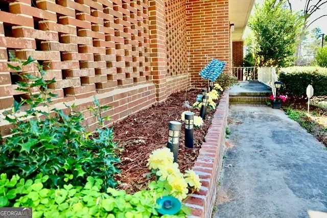 a view of a backyard with chairs