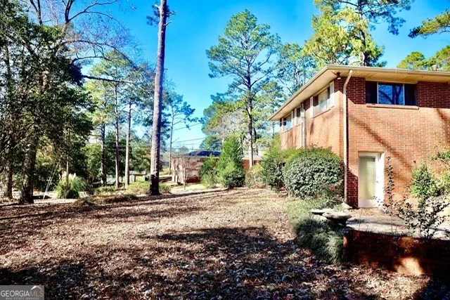 a backyard of a house with lots of green space