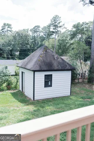 a potted plant sitting in front of a door