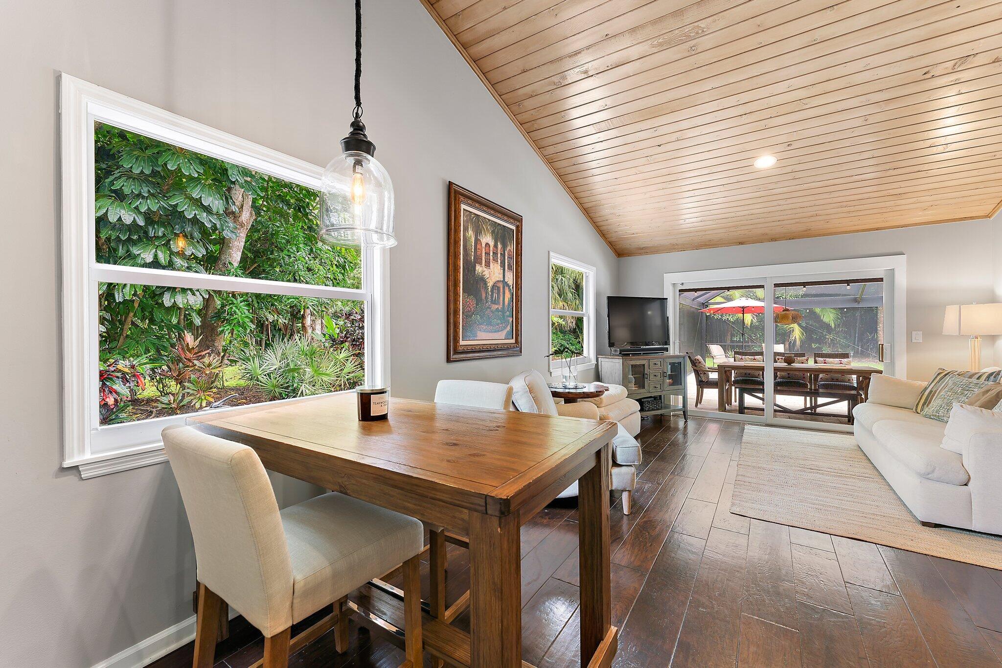 19546 Red Gum Trail Jupiter, FL 33458 - Photo 17 of 42 a dining room with furniture window and wooden floor