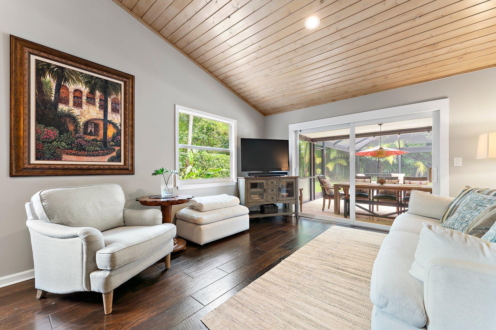19546 Red Gum Trail Jupiter, FL 33458 - Photo 18 of 42 a living room with furniture and a flat screen tv