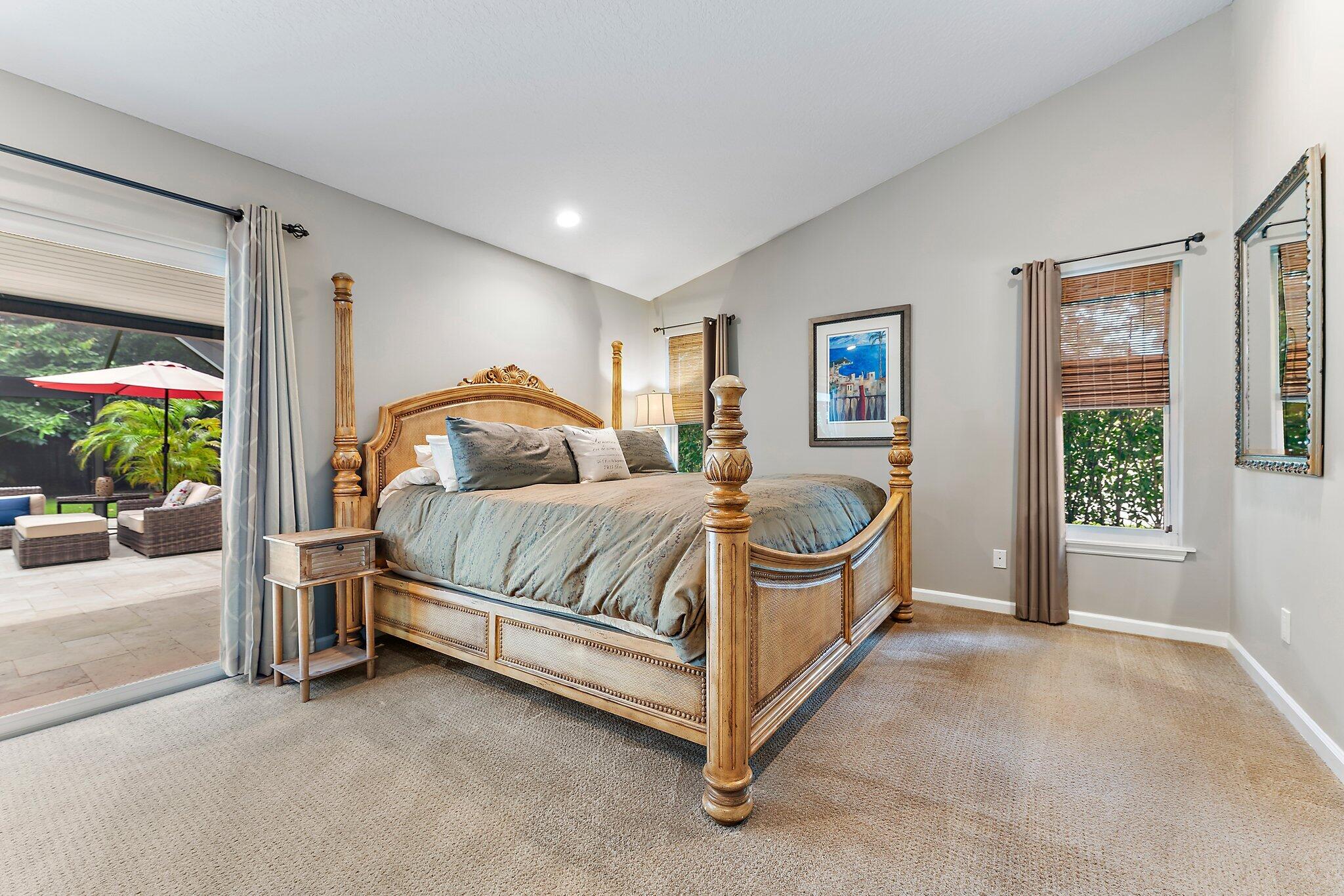 19546 Red Gum Trail Jupiter, FL 33458 - Photo 22 of 42 a bedroom with a bed couch and a window