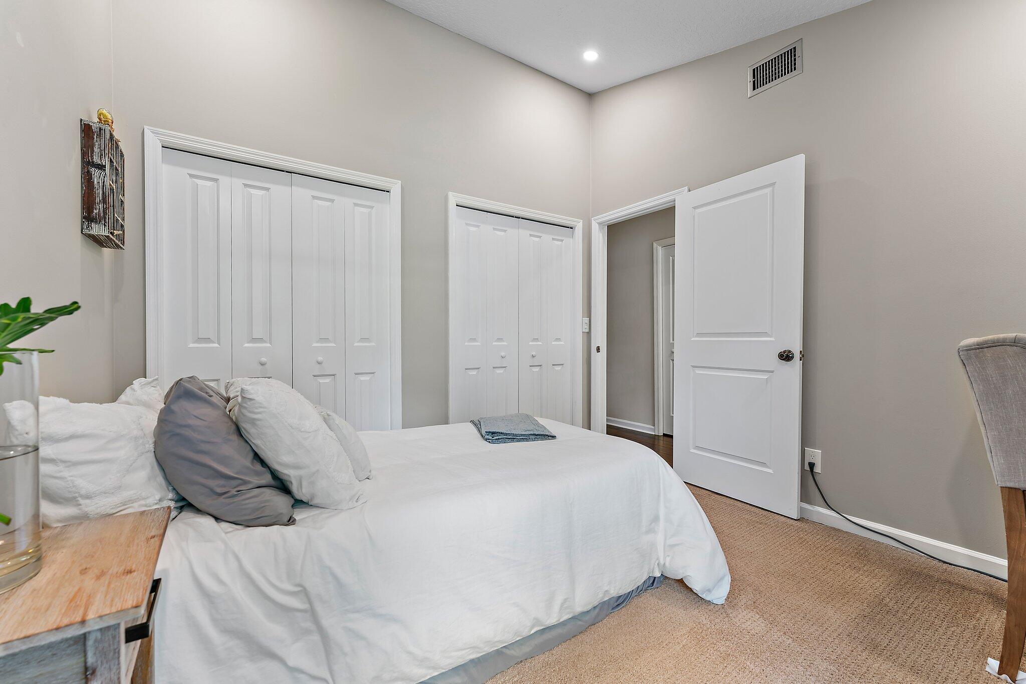 19546 Red Gum Trail Jupiter, FL 33458 - Photo 26 of 42 a bedroom with a bed and a window