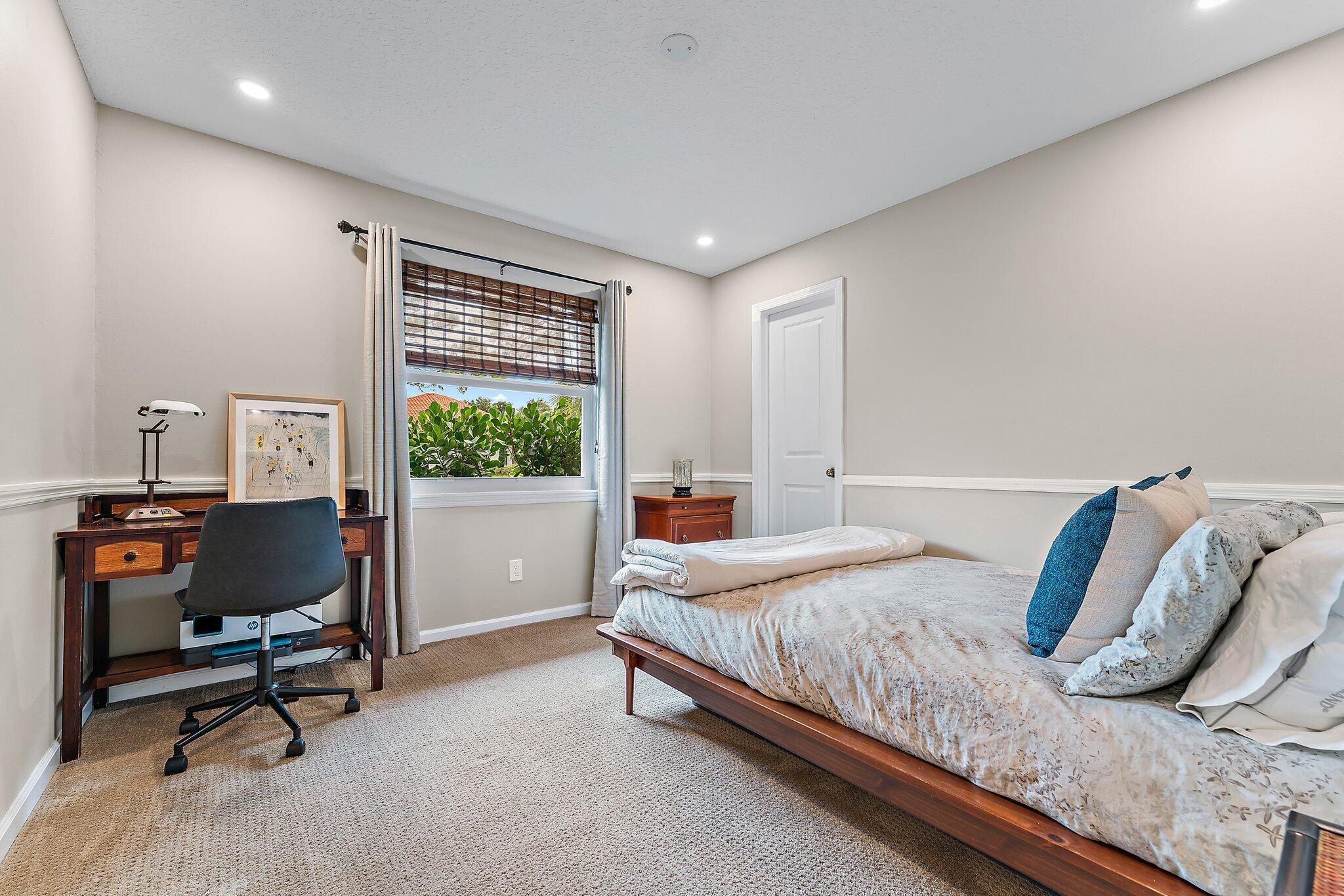 19546 Red Gum Trail Jupiter, FL 33458 - Photo 28 of 42 a bedroom with a bed and a window