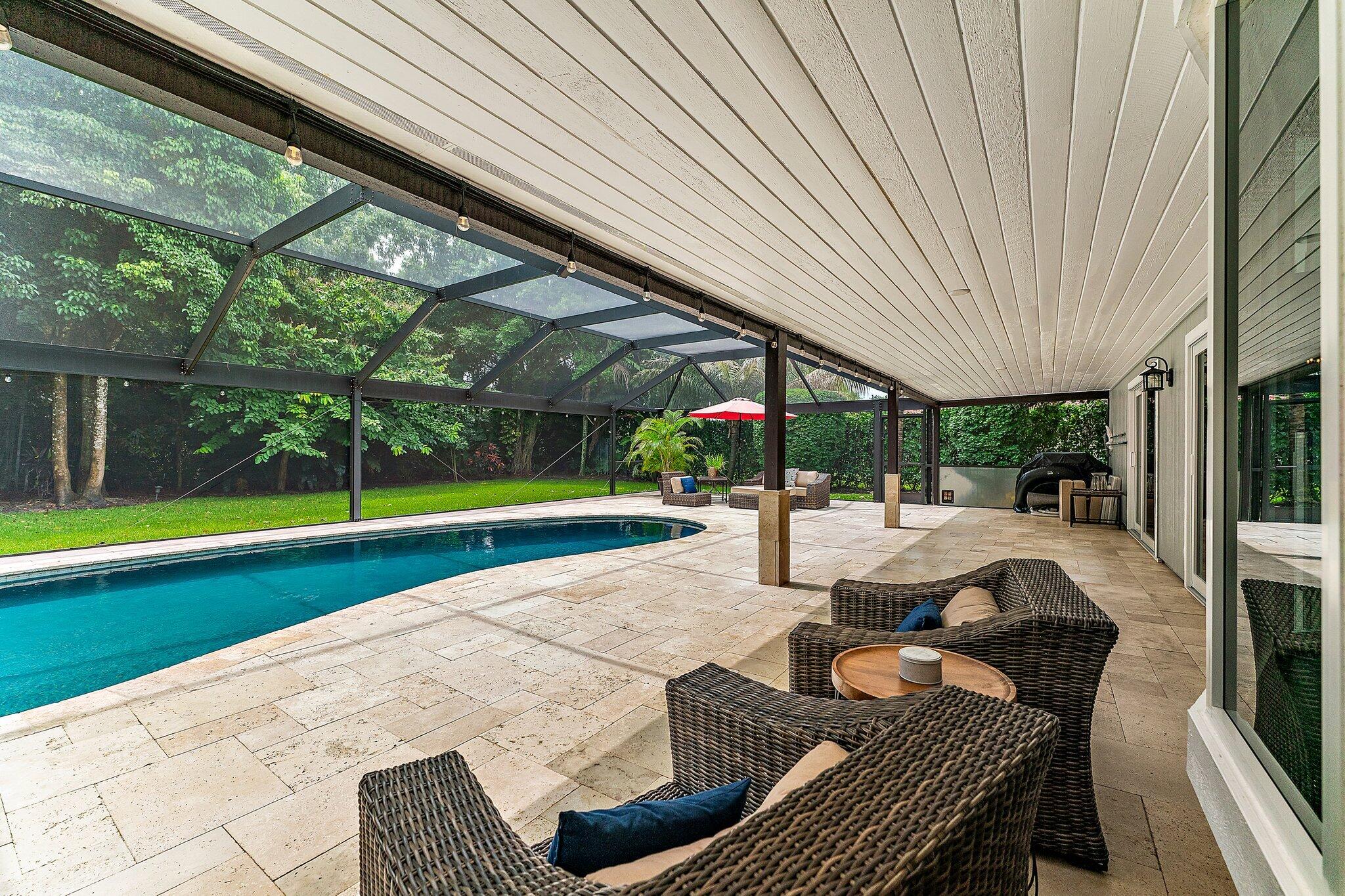 19546 Red Gum Trail Jupiter, FL 33458 - Photo 32 of 42 a view of a patio with couches and pool