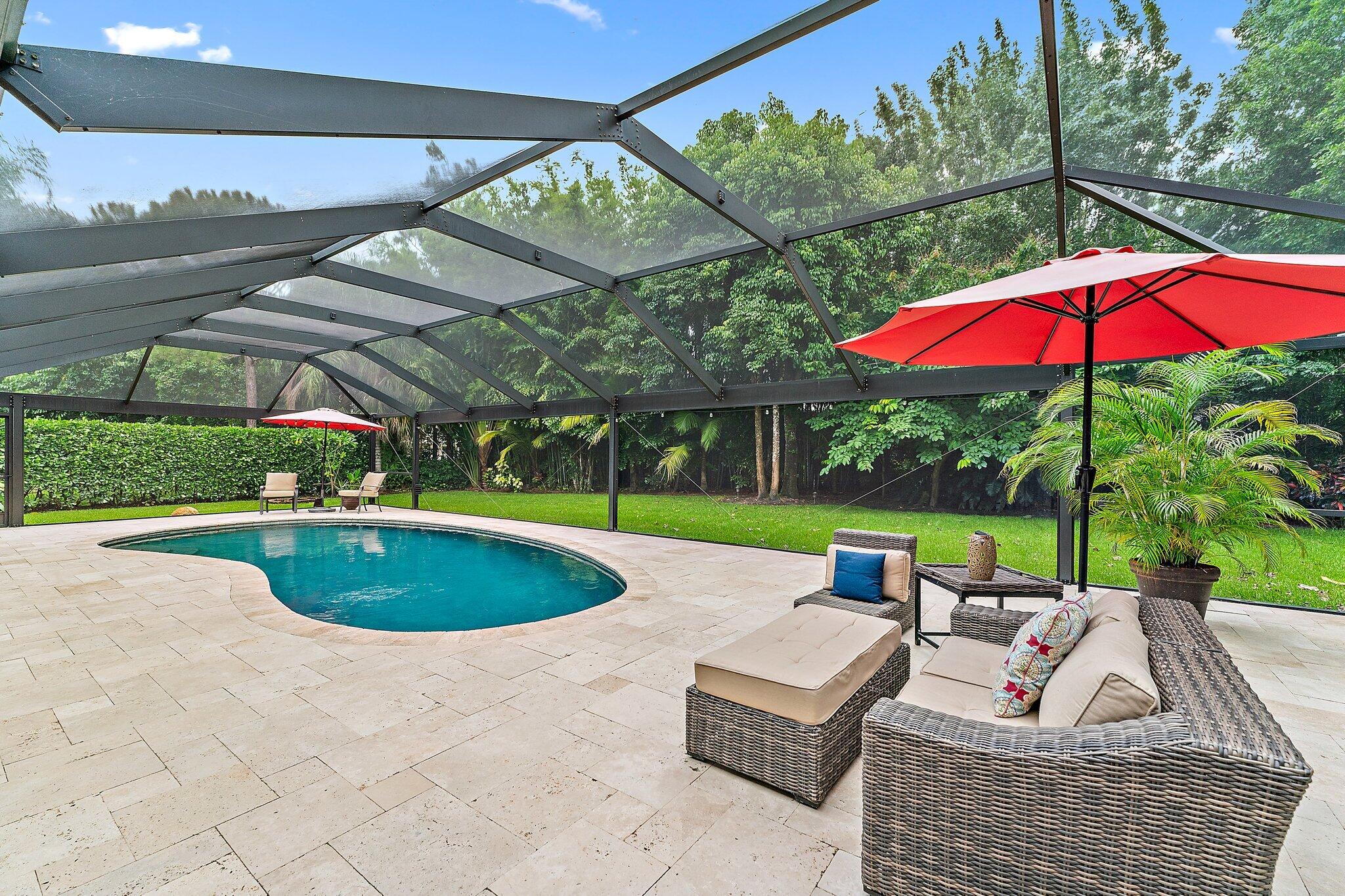 19546 Red Gum Trail Jupiter, FL 33458 - Photo 34 of 42 a view of a swimming pool with a patio