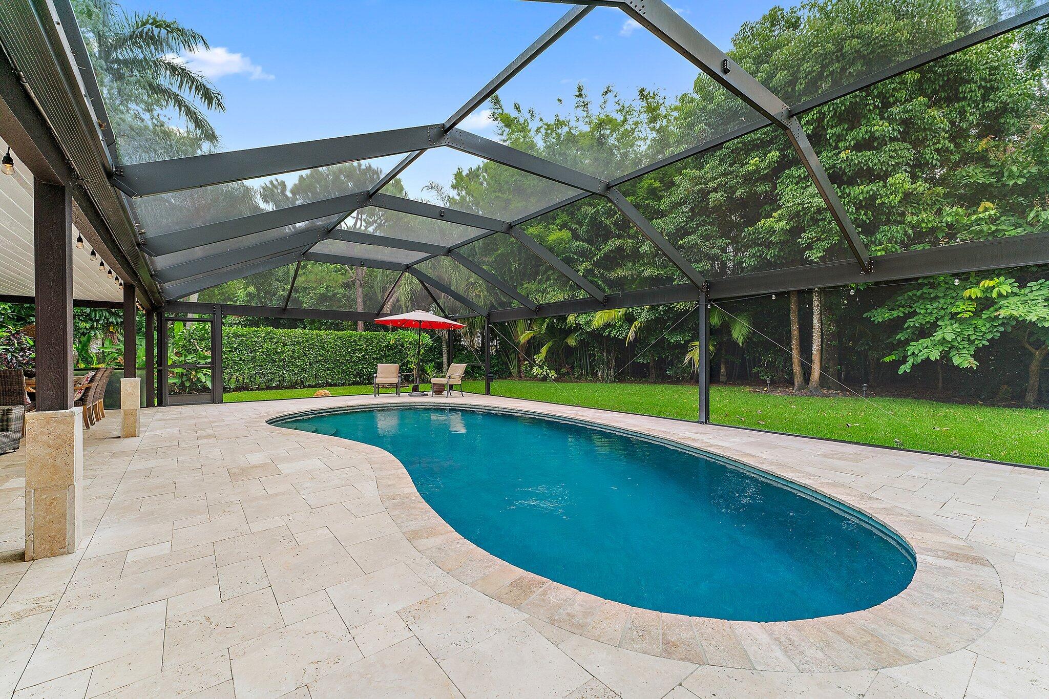 19546 Red Gum Trail Jupiter, FL 33458 - Photo 35 of 42 a view of a swimming pool with a porch