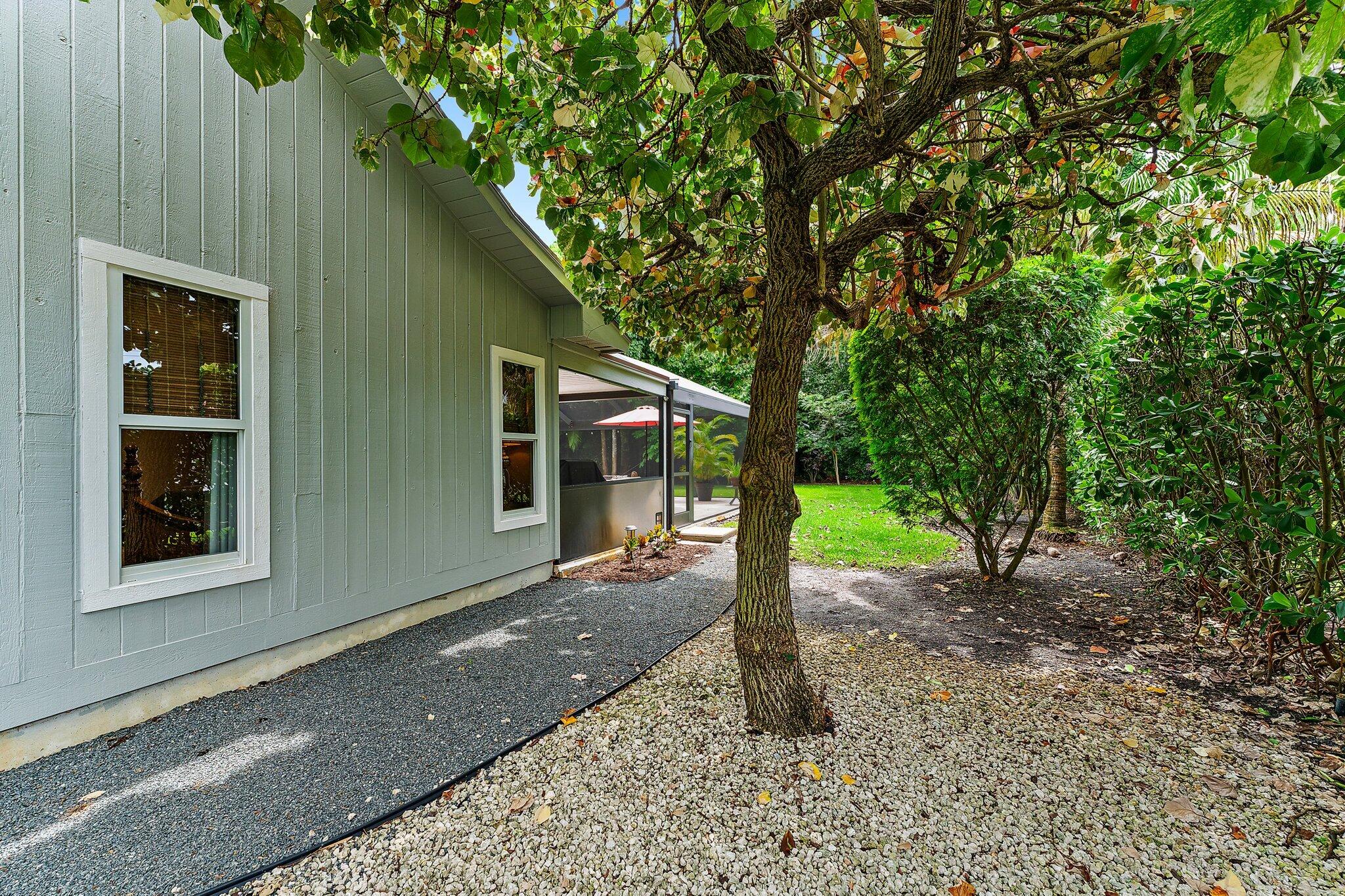 19546 Red Gum Trail Jupiter, FL 33458 - Photo 41 of 42 a view of a house with a backyard