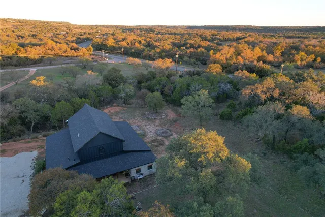 an aerial view of a house with mountain view