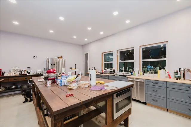 a view of a dining area with furniture and chandelier