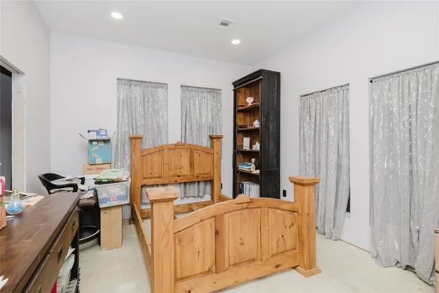 a living room with a bed furniture and a window