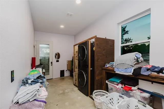 a bedroom with furniture and a closet