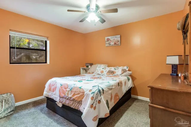 a bedroom with a bed and a dresser