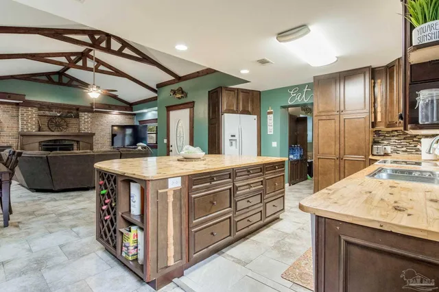 a kitchen with stainless steel appliances granite countertop a stove and a sink