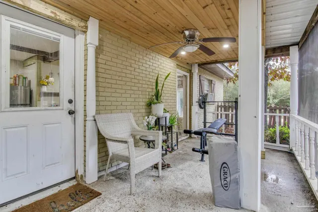 a kitchen with refrigerator and cabinets