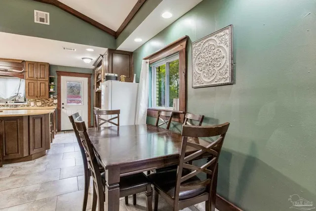 a view of a dining room with furniture