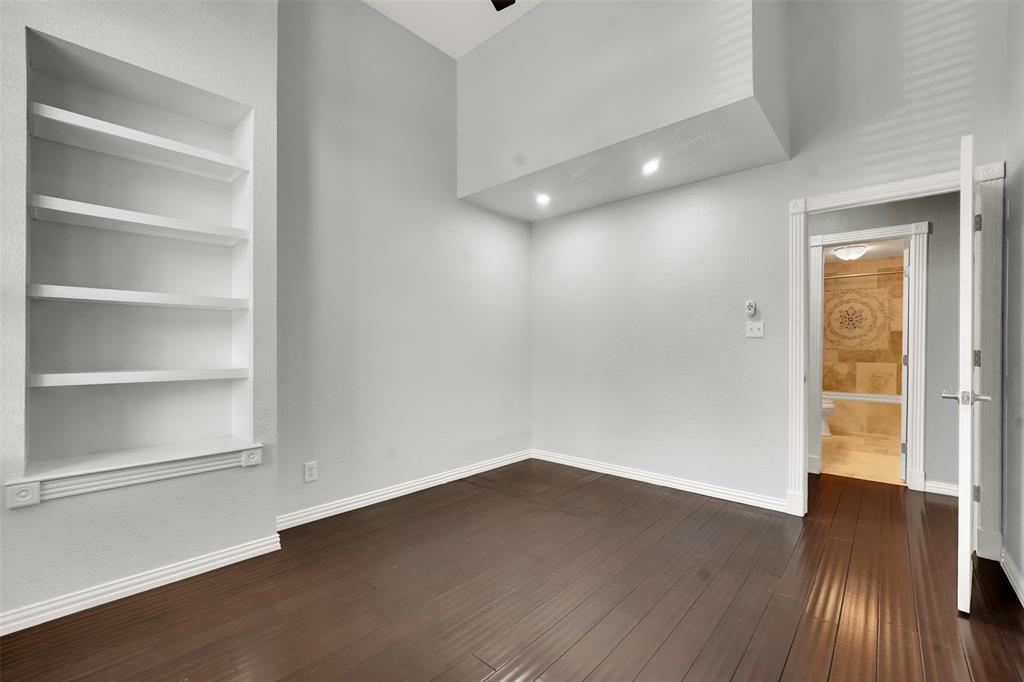 3410 Ridge Oak Drive Garland, TX 75044 - Photo 16 of 29 a view of an empty room with wooden floor and a window