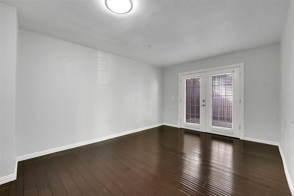 3410 Ridge Oak Drive Garland, TX 75044 - Photo 24 of 29 a view of wooden floor and windows in a room