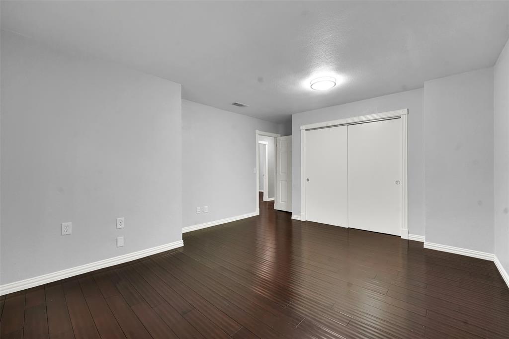 3410 Ridge Oak Drive Garland, TX 75044 - Photo 25 of 29 a view of an empty room with wooden floor