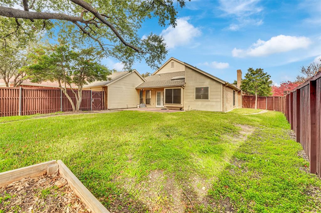 3410 Ridge Oak Drive Garland, TX 75044 - Photo 29 of 29 a view of a house with a yard and sitting area