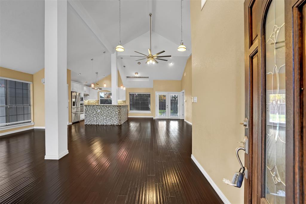 3410 Ridge Oak Drive Garland, TX 75044 - Photo 3 of 29 wooden floor in an empty room with a window