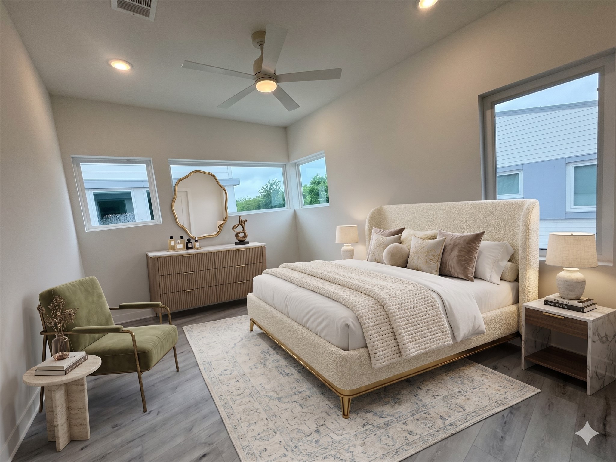 2000 Riverside Farms Road, Unit 19102 Austin, TX 78741 - Photo 11 of 13 This spacious bedroom features large corner windows, allowing ample natural light. It includes a modern ceiling fan, plush bed, and stylish furniture, creating a cozy and inviting atmosphere.