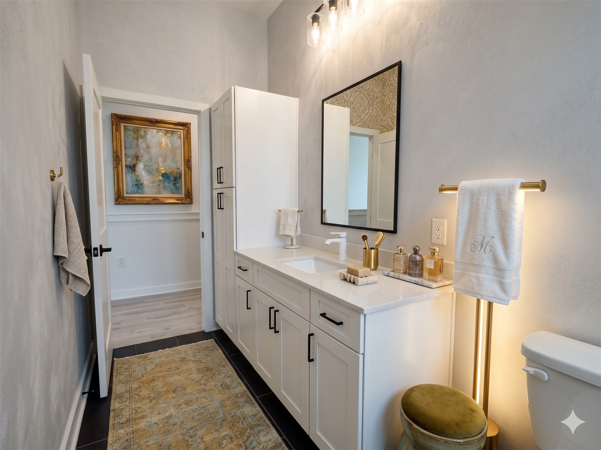 2000 Riverside Farms Road, Unit 19102 Austin, TX 78741 - Photo 8 of 13 This bathroom features a modern design with a sleek white vanity, black hardware, and elegant lighting. It includes a large mirror, stylish decor, and a soft color palette, creating a relaxing atmosphere.