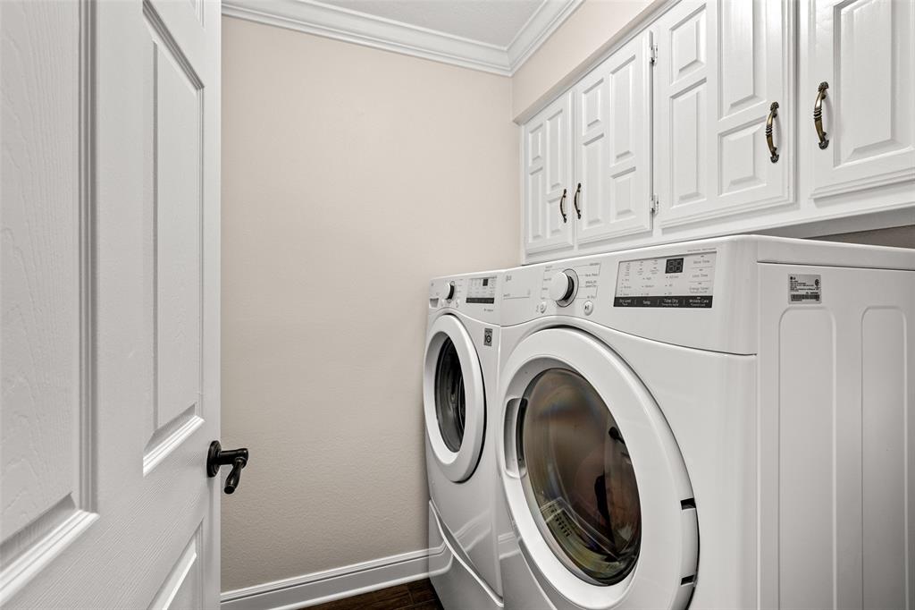 400 Hunters Ridge Circle Coppell, TX 75019 - Photo 22 of 35 a utility room with dryer and washer