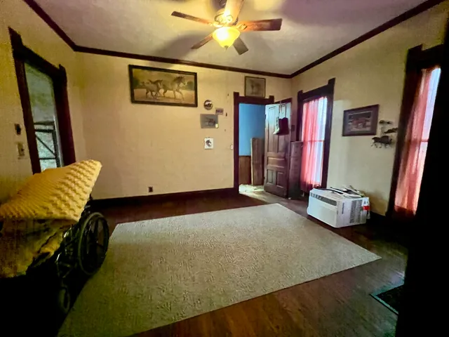 a bedroom with bed and furniture