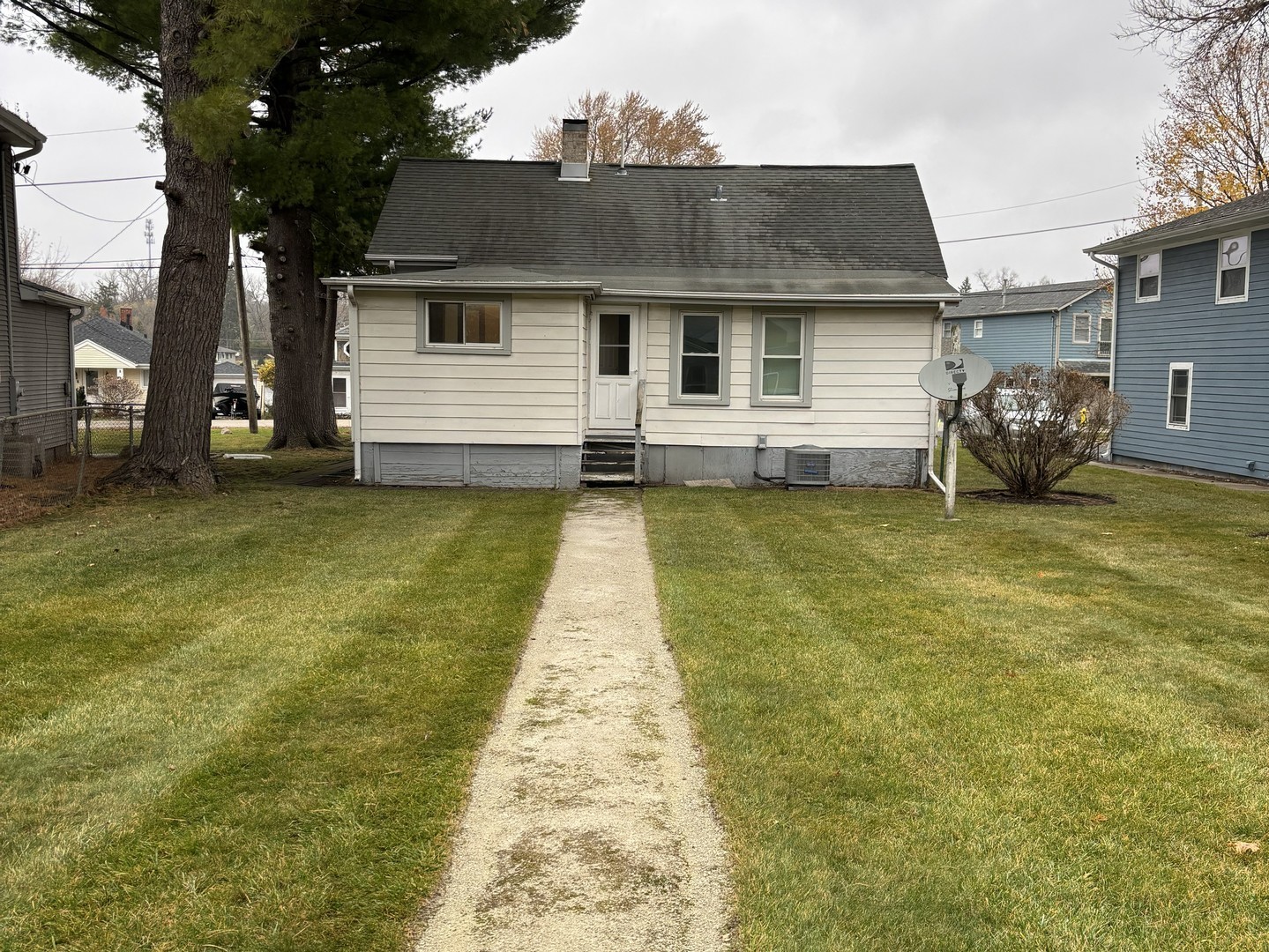 309 North River Road Fox River Grove, IL 60021 - Photo 12 of 13 a front view of a house with a garden