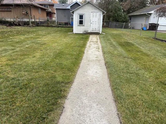 a front view of a house with yard