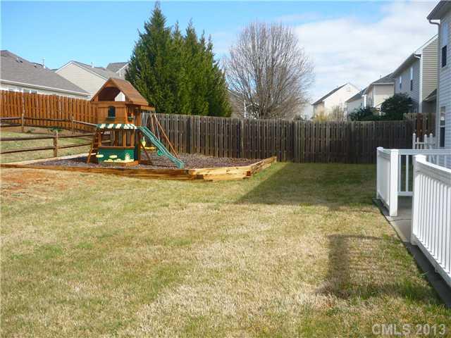 232 Royalton Road Mooresville, NC 28115 - Photo 13 of 16 a view of backyard with wooden fence