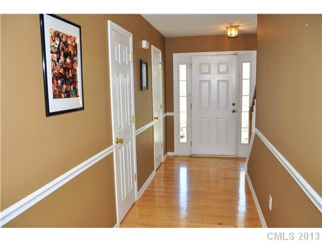 232 Royalton Road Mooresville, NC 28115 - Photo 4 of 16 a view of a hallway with wooden floor