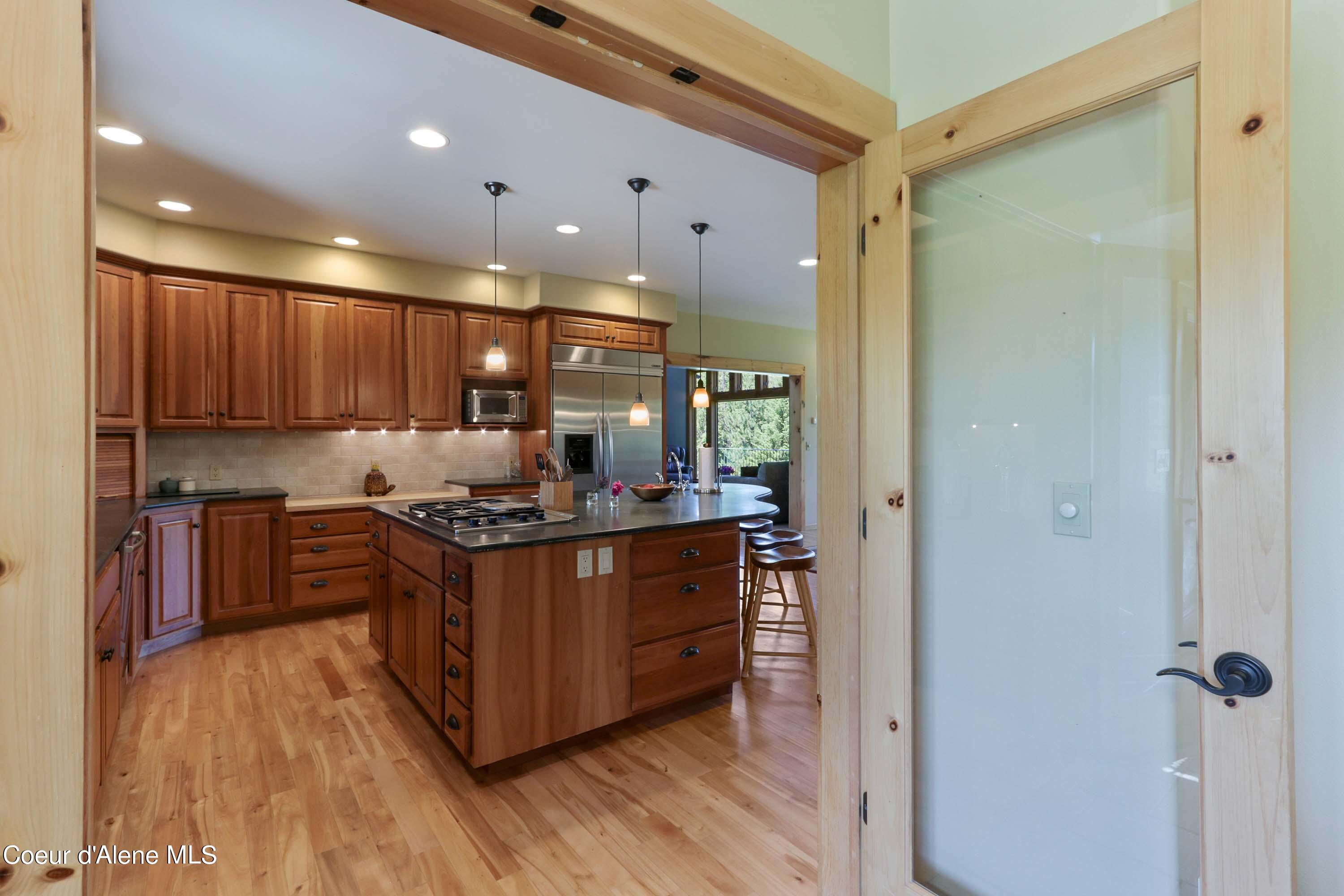 877 Heath Lake Road Sagle, ID 83860 - Photo 18 of 61 Sunroom to Kitchen