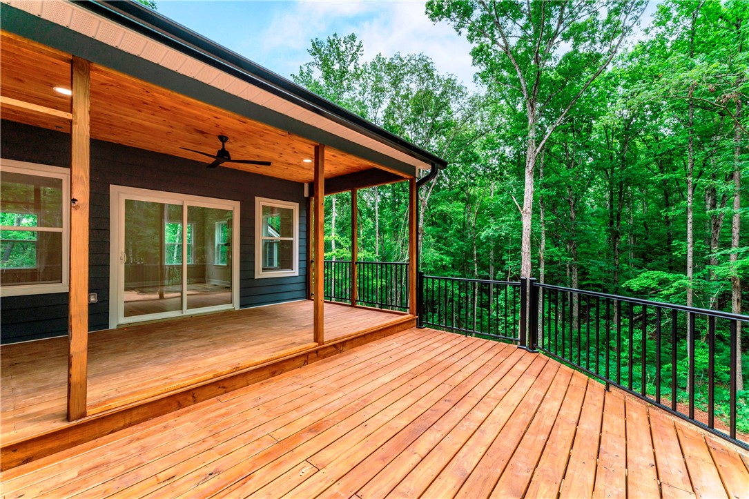 110 Gabriel Way Pickens, SC 29671 - Photo 34 of 48 A spacious wooden deck provides serene views of surrounding nature.