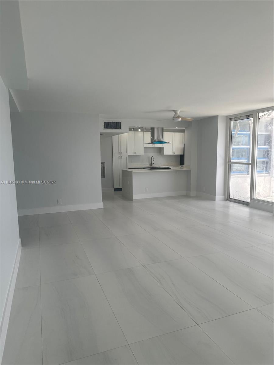 4280 Galt Ocean Drive, Unit 17C Fort Lauderdale, FL 33308 - Photo 11 of 16 a room with a cabinets and a fireplace