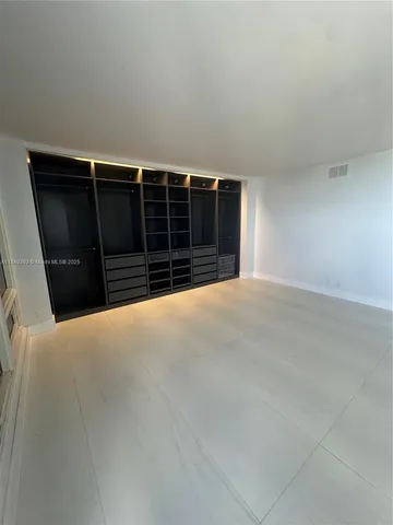 a view of a livingroom with a walk in closet