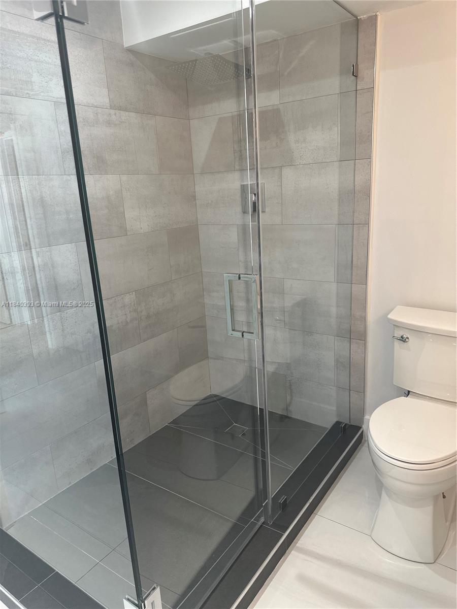 4280 Galt Ocean Drive, Unit 17C Fort Lauderdale, FL 33308 - Photo 9 of 16 a bathroom with a shower and toilet