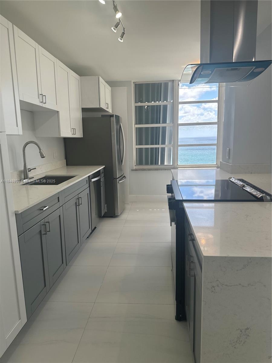 4280 Galt Ocean Drive, Unit 17C Fort Lauderdale, FL 33308 - Photo 10 of 16 a kitchen with stainless steel appliances granite countertop a sink stove and refrigerator