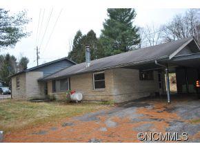 208 Green Valley Road Waynesville, NC 28786 - Photo 1 of 15 a house with trees in the background
