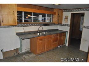 208 Green Valley Road Waynesville, NC 28786 - Photo 15 of 15 a kitchen with a sink and a window