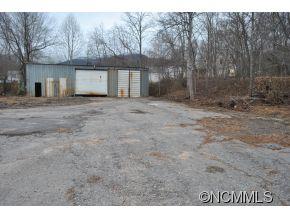208 Green Valley Road Waynesville, NC 28786 - Photo 6 of 15 a view of a house with a yard and a garage