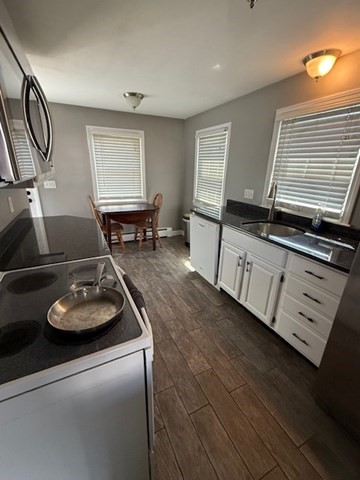 22 Forest Street, Unit 1 Ayer, MA 01432 - Photo 4 of 14 a room with furniture and window