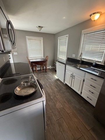 22 Forest Street, Unit 1 Ayer, MA 01432 - Photo 5 of 14 a living room with furniture and a window